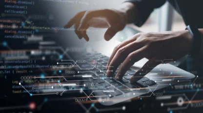 Hands typing on a laptop keyboard with coding and digital interface graphics overlay.